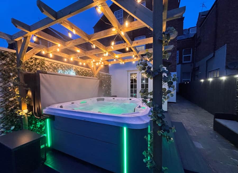 Private illuminated hot tub and pergola at Apartment 1