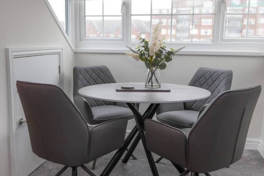 Dining table beside the window in Apartment 3